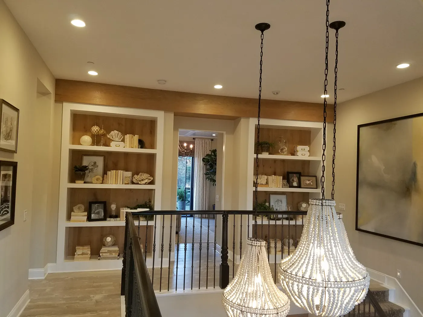 Built in bookcases along a stair landing