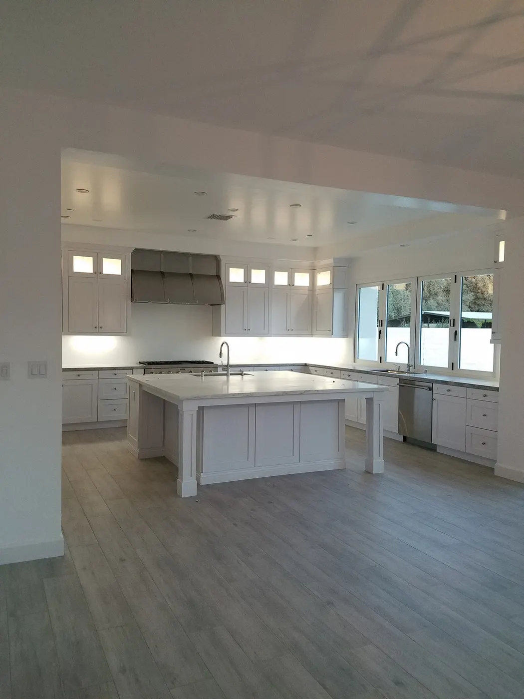 Bright white custom kitchen with a large island